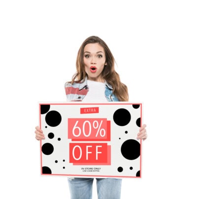 Woman holding sale banner