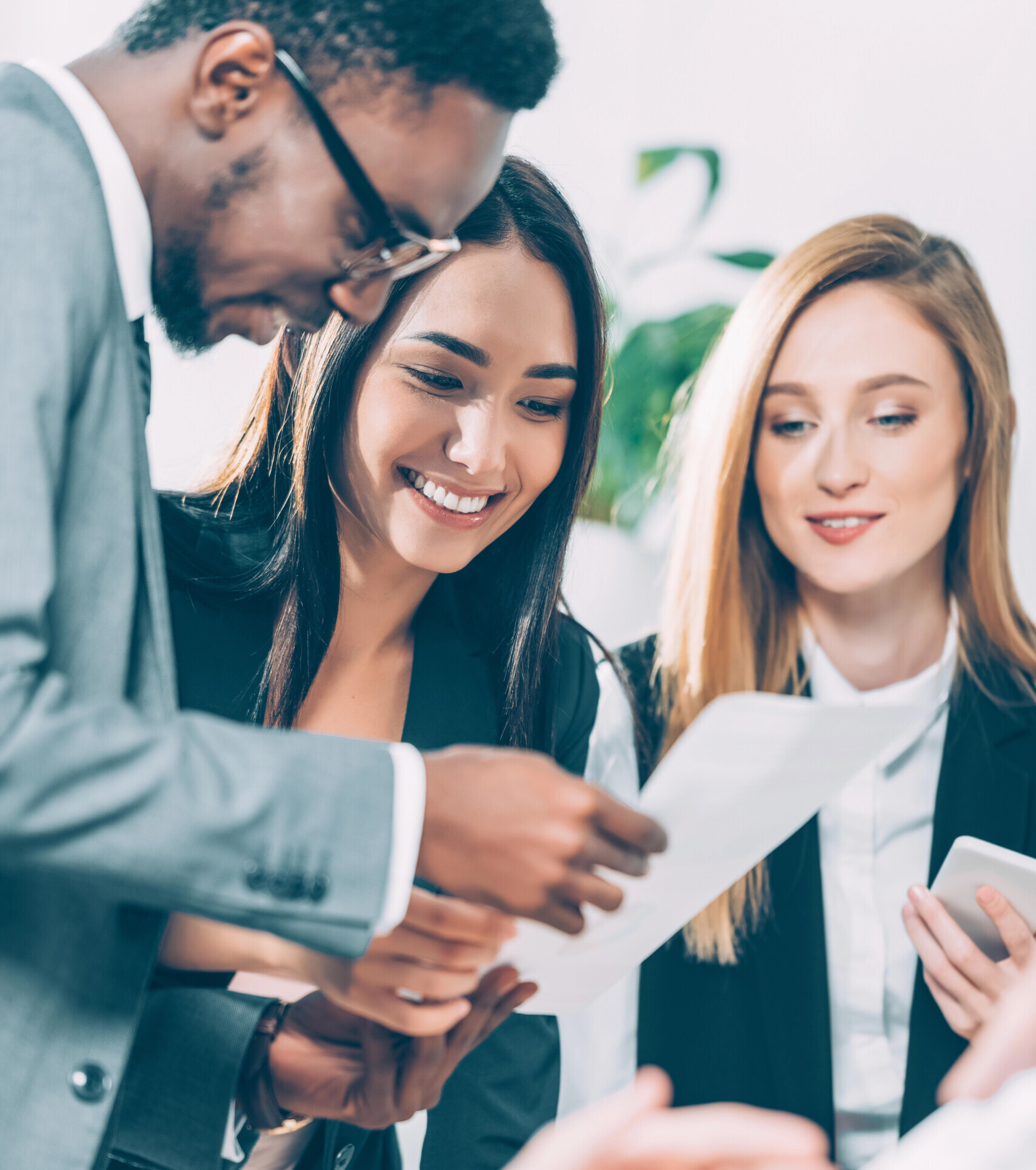 Group of multiethnic businesspeople exploring documents
